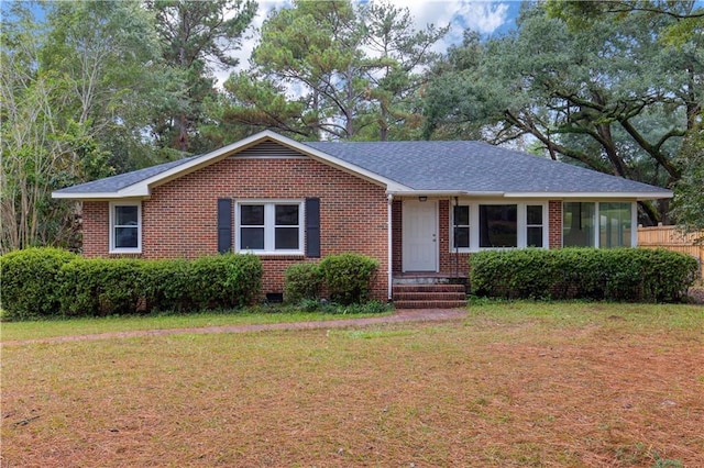 424 Byron Ave E, Mobile, AL 36609 - view of front facade with brick siding, a front yard, and roof with shingles