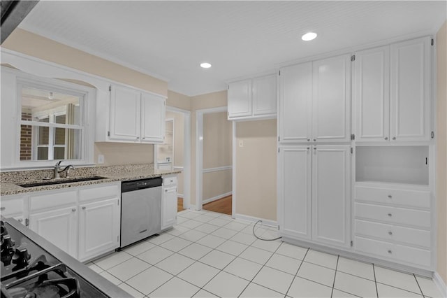 kitchen featuring light tile patterned floors, light stone countertops, sink, white cabinets, and stainless steel dishwasher