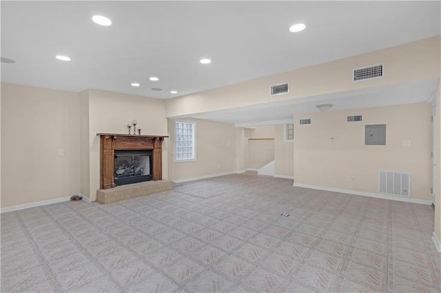 424 Byron Ave E, Mobile, AL 36609 - unfurnished living room with electric panel, baseboards, light carpet, and recessed lighting
