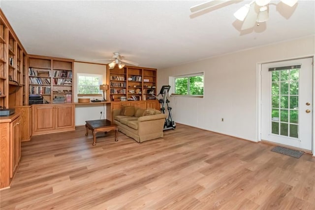 258 Suffolk Rd, Mobile, AL 36608 - living area with ceiling fan, light wood-type flooring, healthy amount of natural light, and ornamental molding