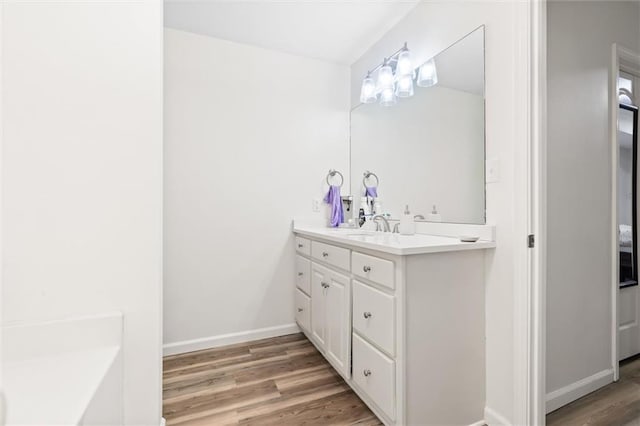192 Bay View Dr, Daphne, AL 36526 - bathroom featuring wood finished floors and vanity