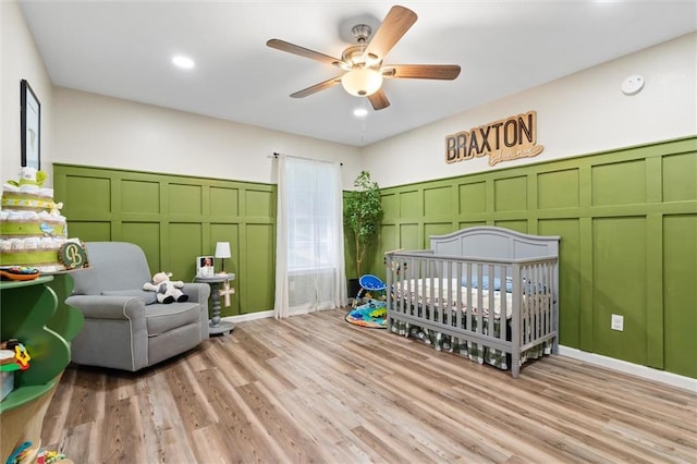 192 Bay View Dr, Daphne, AL 36526 - bedroom featuring a decorative wall, a nursery area, light wood finished floors, a ceiling fan, and recessed lighting