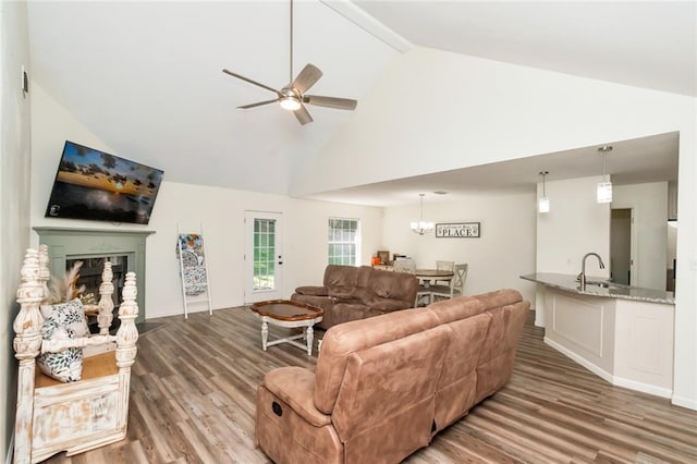 192 Bay View Dr, Daphne, AL 36526 - living area with a ceiling fan, wood finished floors, high vaulted ceiling, beamed ceiling, and a fireplace