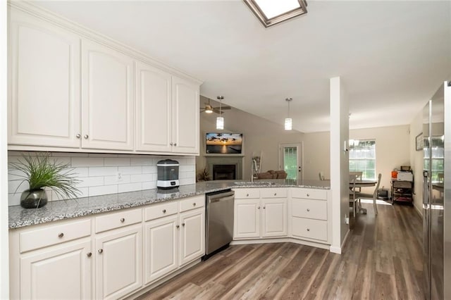 192 Bay View Dr, Daphne, AL 36526 - kitchen featuring appliances with stainless steel finishes, tasteful backsplash, wood finished floors, and white cabinets