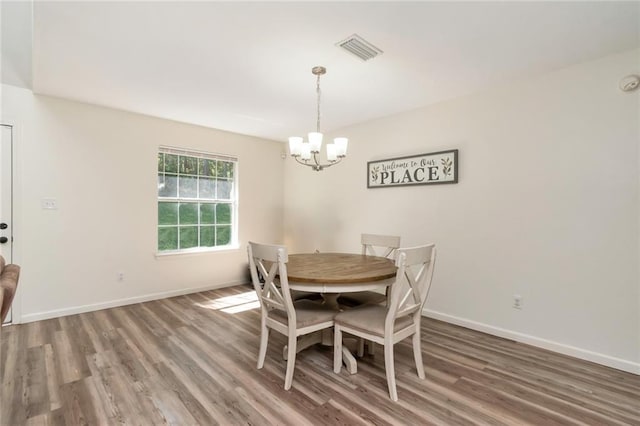 192 Bay View Dr, Daphne, AL 36526 - dining area with a chandelier and wood finished floors