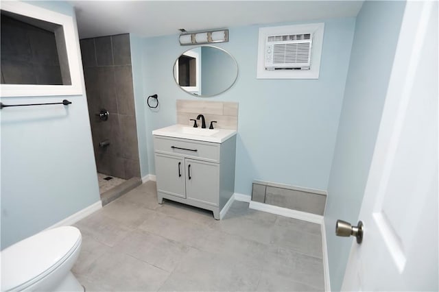bathroom with vanity, a wall mounted AC, baseboards, toilet, and a walk in shower
