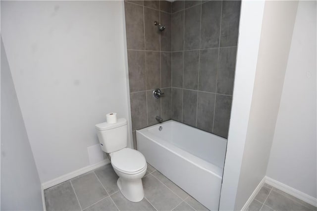 full bath featuring tile patterned floors, baseboards, shower / tub combination, and toilet