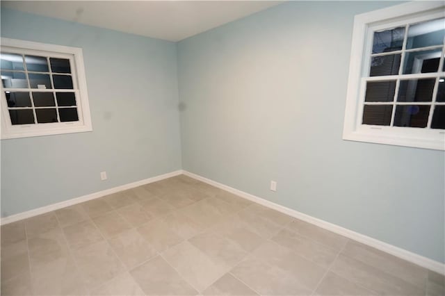 empty room with baseboards