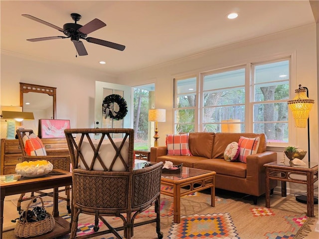 living room featuring ornamental molding and ceiling fan