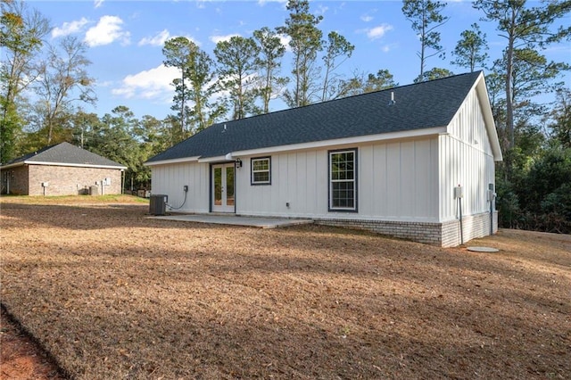 back of property featuring central AC unit and a patio