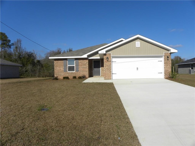 ranch-style house with a garage and a front yard