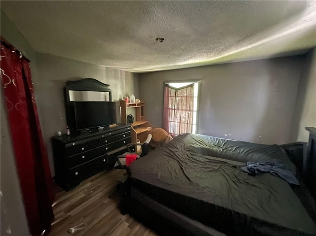 1008 Miami St, Mobile, AL 36604 - bedroom featuring a textured ceiling and wood finished floors