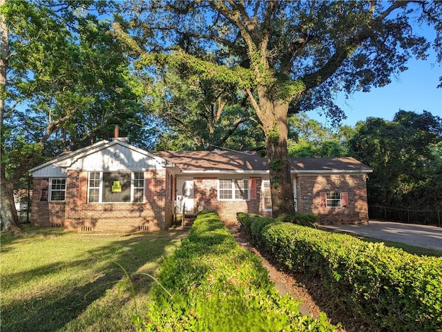 1151 Navco Rd, Mobile, AL 36605 - ranch-style house featuring brick siding, a front yard, and a chimney