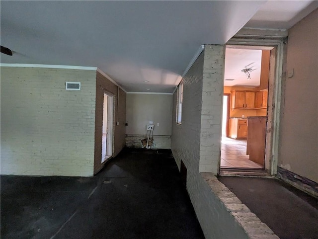 1151 Navco Rd, Mobile, AL 36605 - corridor with brick wall and carpet floors
