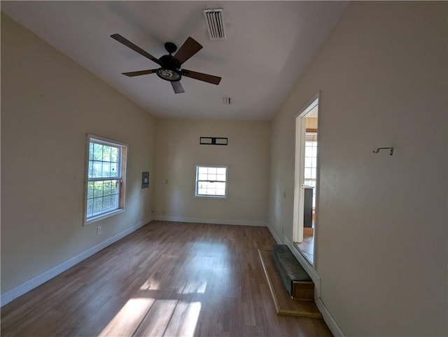 1151 Navco Rd, Mobile, AL 36605 - spare room with wood finished floors, ceiling fan, vaulted ceiling, and baseboards