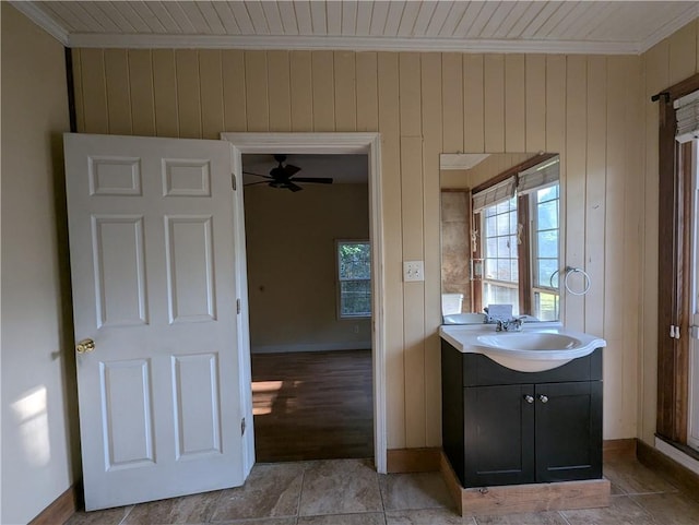 1151 Navco Rd, Mobile, AL 36605 - bathroom with ornamental molding, vanity, a ceiling fan, baseboards, and wooden walls