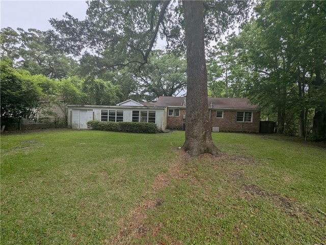 1151 Navco Rd, Mobile, AL 36605 - ranch-style house featuring a front lawn, brick siding, and a garage
