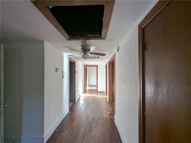 1151 Navco Rd, Mobile, AL 36605 - hall with wood finished floors, baseboards, and a textured ceiling