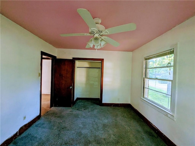 1151 Navco Rd, Mobile, AL 36605 - unfurnished bedroom with carpet flooring, baseboards, a closet, and a ceiling fan