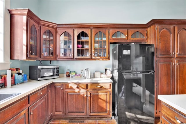 kitchen featuring black refrigerator