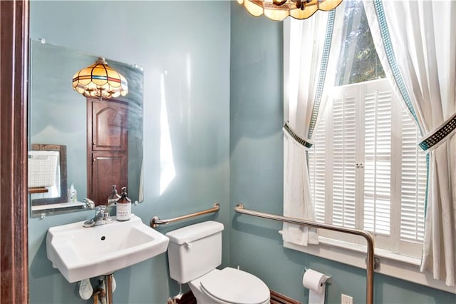 bathroom with sink and toilet