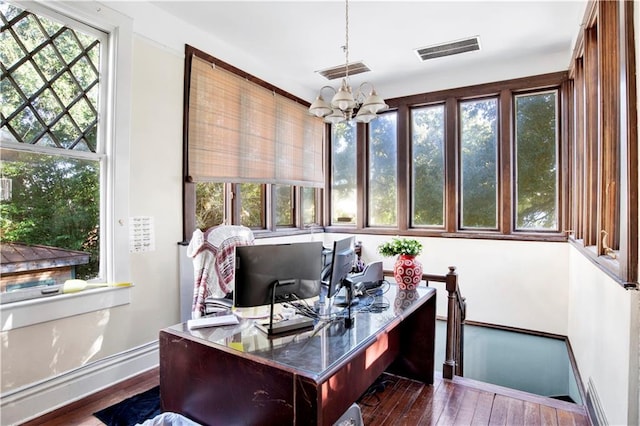 office space with a chandelier and dark hardwood / wood-style floors