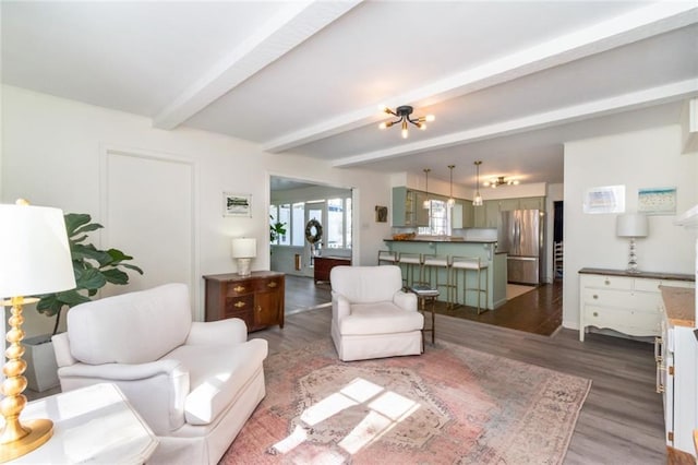 living room featuring wood-type flooring and beamed ceiling