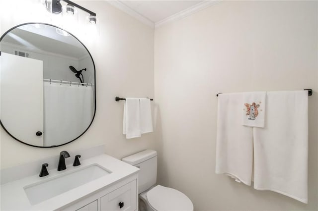 bathroom featuring curtained shower, toilet, vanity, and crown molding