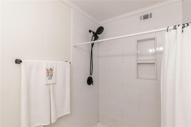 bathroom featuring walk in shower and crown molding