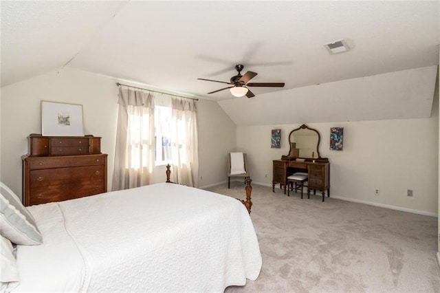 bedroom featuring vaulted ceiling, light colored carpet, and ceiling fan