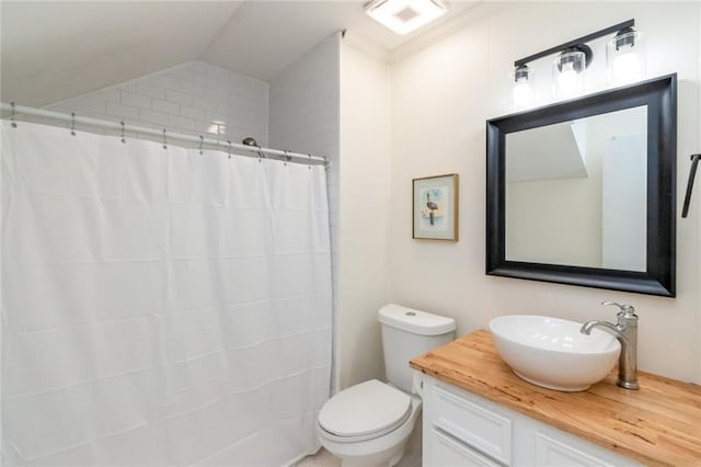 bathroom with walk in shower, toilet, vaulted ceiling, and vanity