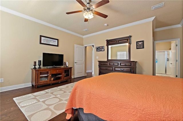 bedroom featuring visible vents, baseboards, dark wood finished floors, arched walkways, and ornamental molding