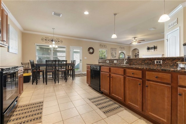 kitchen featuring black dishwasher, decorative light fixtures, visible vents, dark stone counters, and range