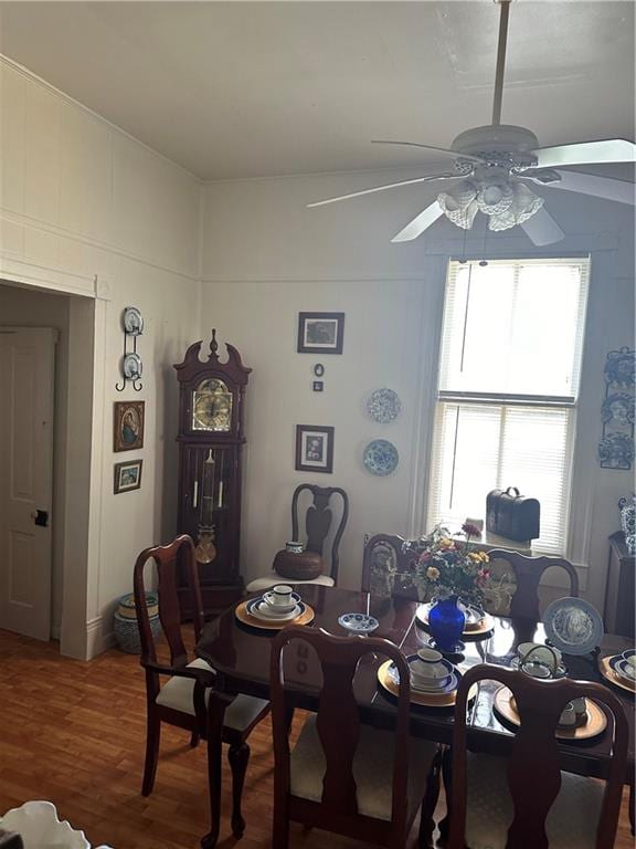 dining area with hardwood / wood-style flooring, a healthy amount of sunlight, and ceiling fan