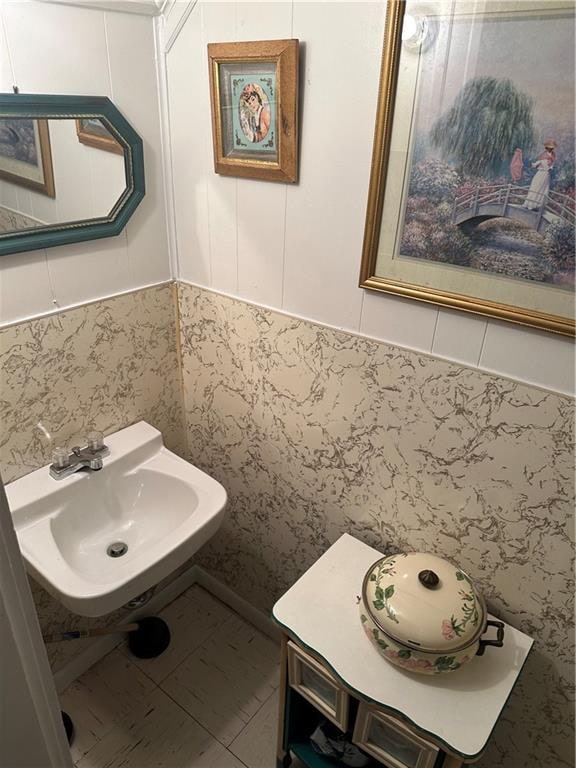 bathroom with sink and tile patterned flooring