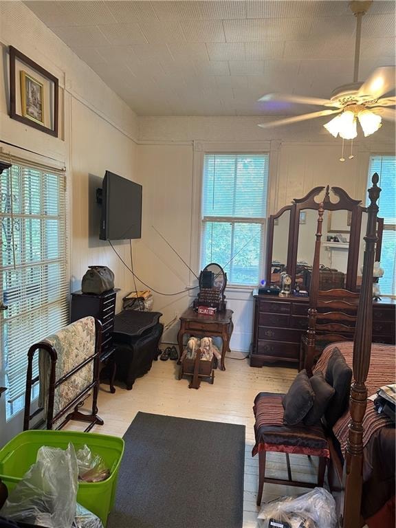 bedroom featuring hardwood / wood-style floors and ceiling fan