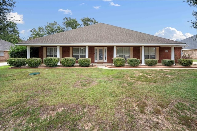 single story home with a porch and a front lawn