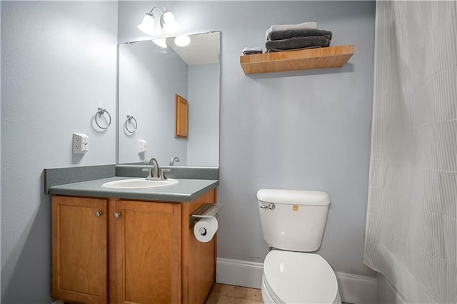 bathroom featuring vanity, toilet, curtained shower, and tile patterned flooring