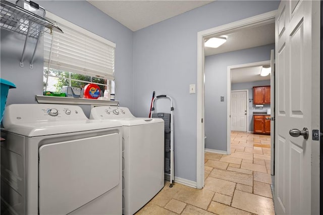 laundry room featuring washing machine and clothes dryer