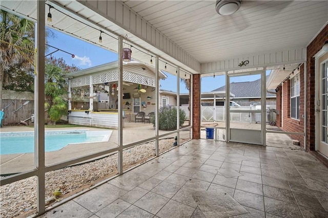 unfurnished sunroom featuring wooden ceiling