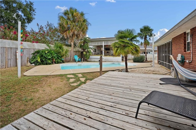 exterior space featuring a fenced in pool and a lawn