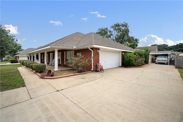 ranch-style house featuring a garage and a porch