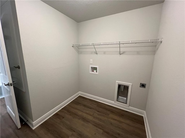 laundry area featuring hookup for a washing machine, electric dryer hookup, dark wood-type flooring, and a textured ceiling