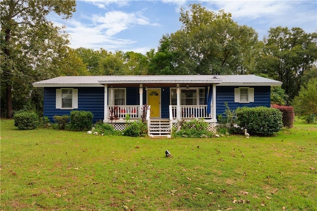 ranch-style house with a front lawn and covered porch