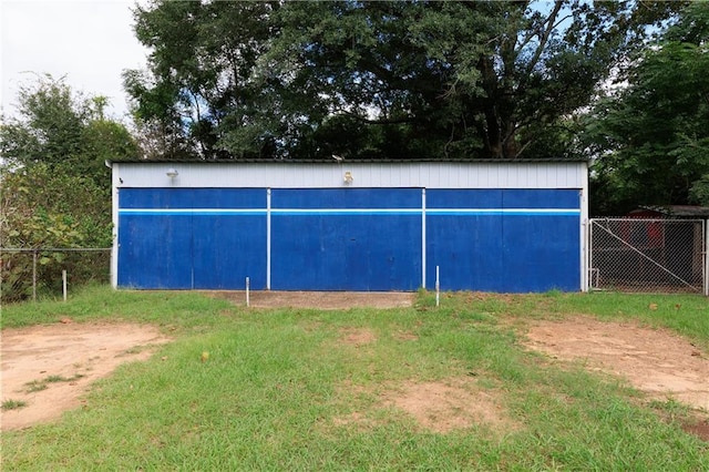 view of outbuilding with fence