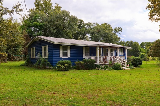 single story home featuring a front yard and covered porch
