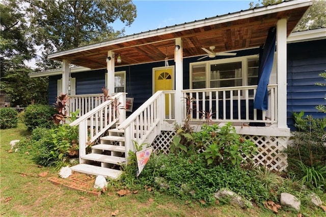 doorway to property featuring a ceiling fan and covered porch