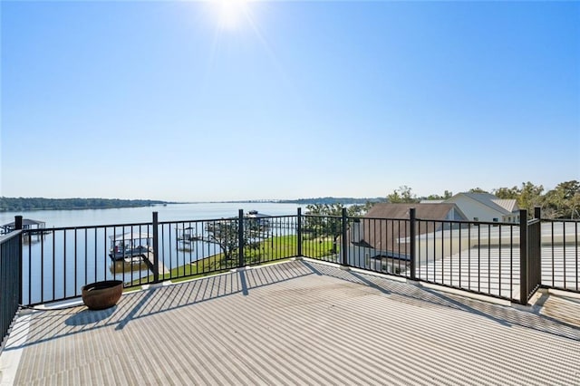 wooden terrace with a water view