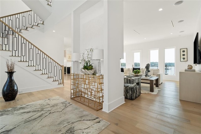 foyer entrance with light hardwood / wood-style floors