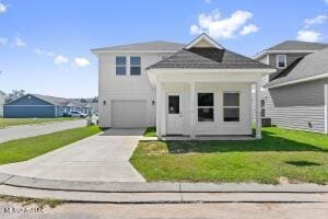 view of front facade featuring a garage and a front lawn